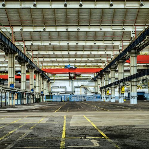 Expansive industrial warehouse interior showcasing steel framework and spacious layout for diverse manufacturing needs.